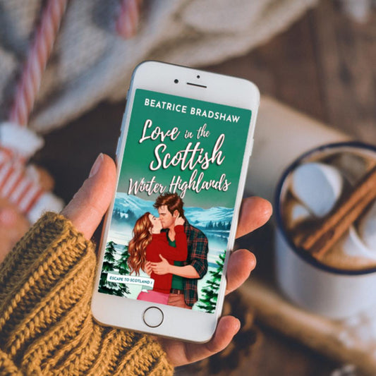 Phone displaying a book cover of 'Love in the Scottish Winter Highlands' by Beatrice Bradshaw, held by a person with a cozy background.